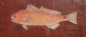 Sanchez, Mario. Boca Grande Redfish. Carved oil on board, 7 one half by 16 three quarters inches.